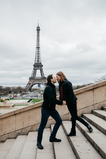 Beautiful romantic couple in paris near the eiffel tower