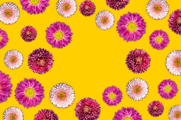 Beautiful romantic flat lay flowers. chrysanthemums on a yellow background with copy space