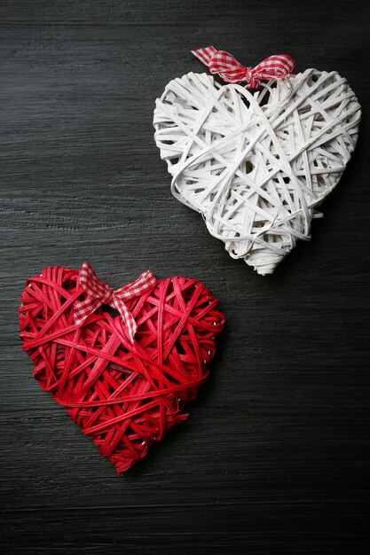 Beautiful romantic hearts on wooden background