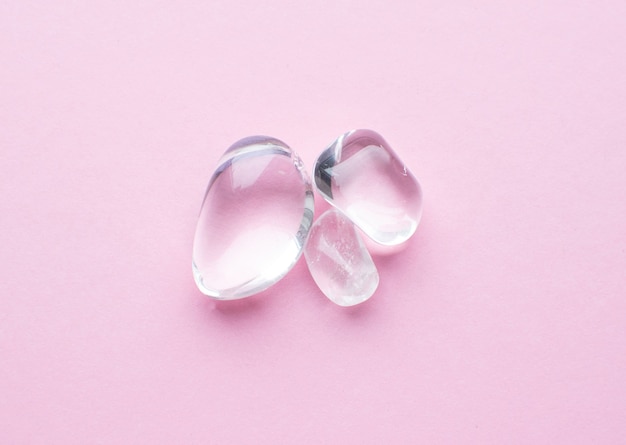 Beautiful round cut rhinestone stones on a pink surface