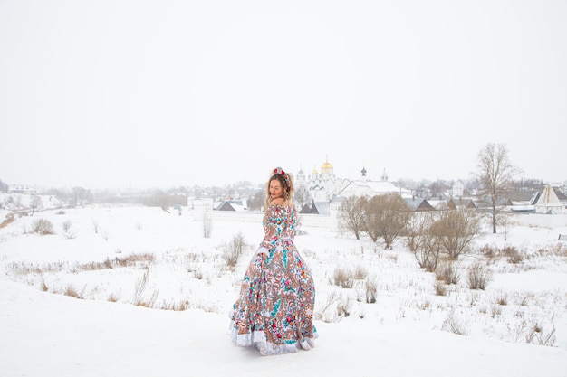 Beautiful russian girl in a winter national dress