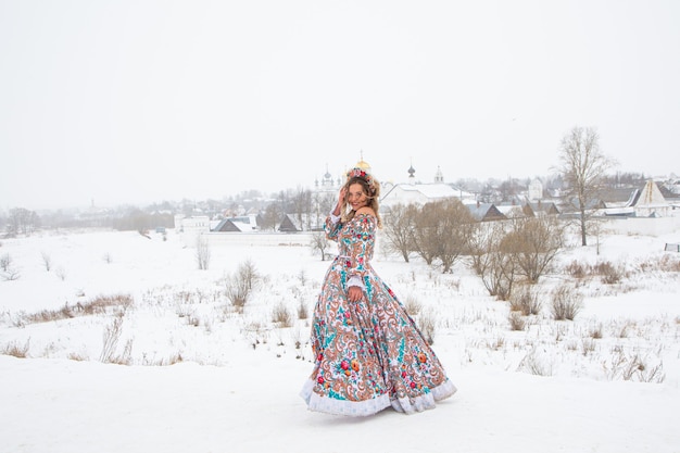 Beautiful russian girl in a winter national dress