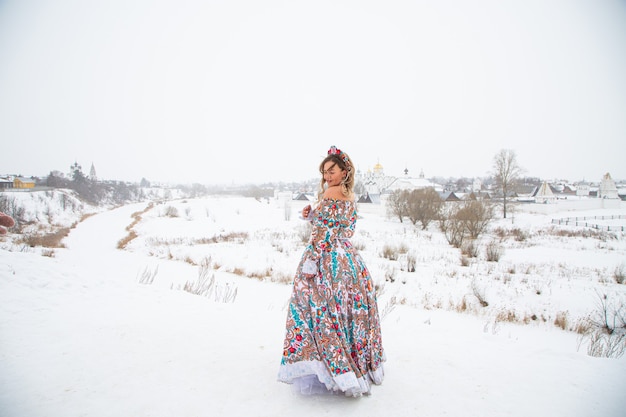 Beautiful russian girl in a winter national dress