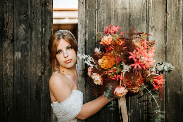 Beautiful rustic bride with a bouquet