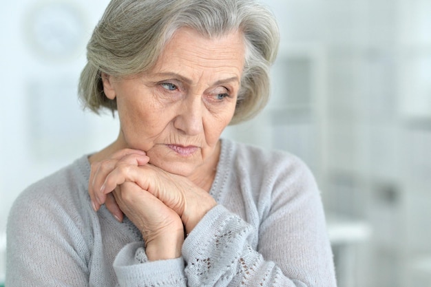 Beautiful sad elderly woman closeup