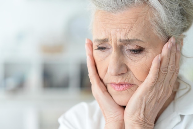 Beautiful sad elderly woman