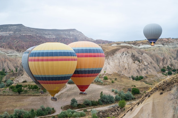 Beautiful scenery flight of balloons in the mountains of Cappadocia