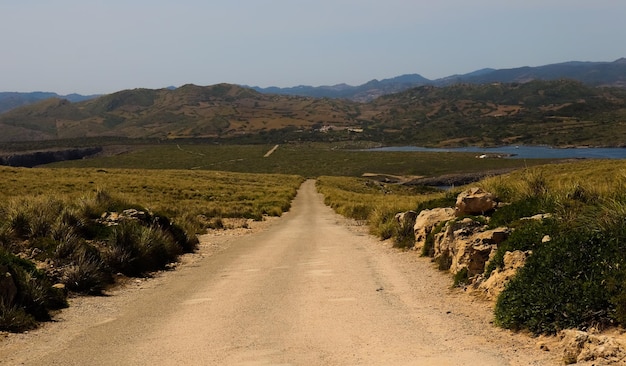 Beautiful scenery of the a valley with a road through the mountains in Menorca Islas Baleares Spain