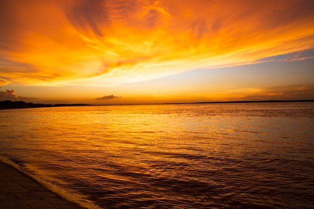 Beautiful Scenic View Of Sea Against Orange Sky