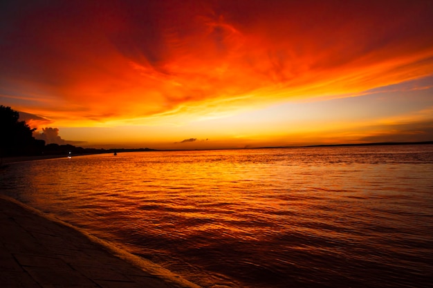 Beautiful Scenic View Of Sea Against Orange Sky