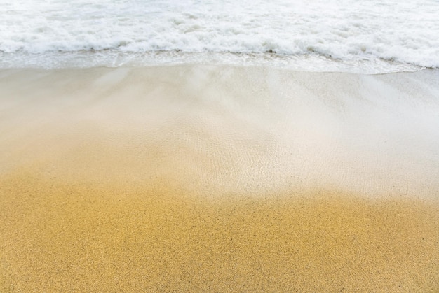 Beautiful sea coast Waves with foam Summer travel concept Sand with buoy in water