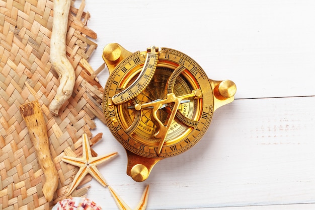 Beautiful sea composition with shells and vintage compass