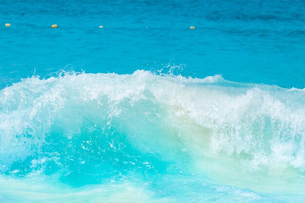 The beautiful sea wave with blue foam and turquoise color