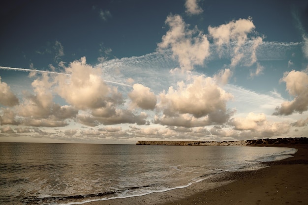 Beautiful sealandscape with dramatic clouds over blue sky and soft waves Beauty world natural outdoors travel background