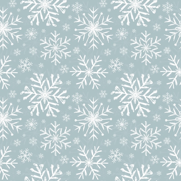 青色の背景に雪片の美しいシームレス パターン