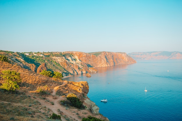 Beautiful seascape. Amazing composition of nature with mountains and cliffs.