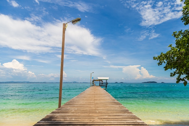 Beautiful seascape picture a wooden bridge to pavillion in the sea.