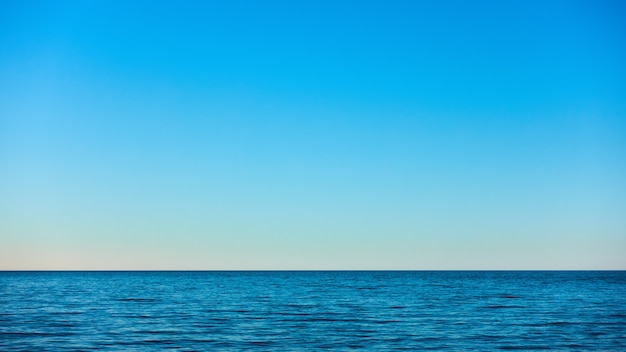 Beautiful seascape with sea horizon and blue sky, natural photo background
