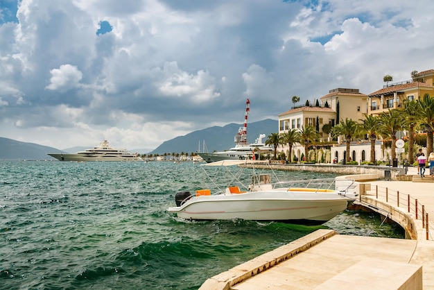 Beautiful seascape with a small yacht in the port of Tivat