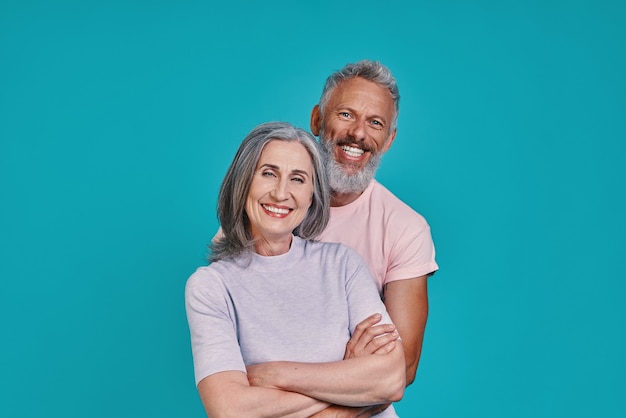 Beautiful senior couple looking at camera and smiling 