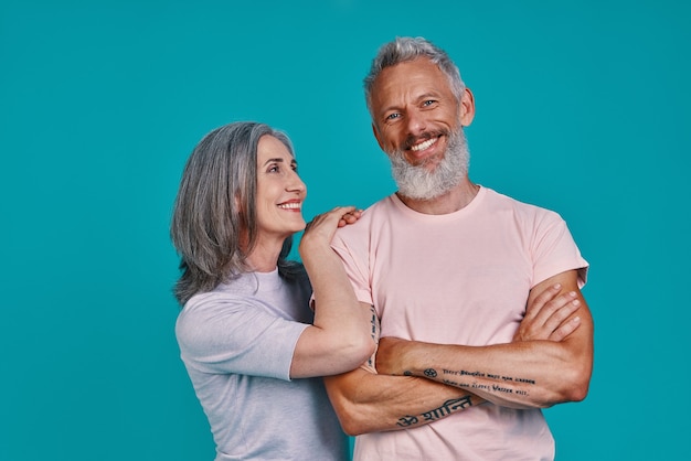 Beautiful senior couple looking at camera and smiling 