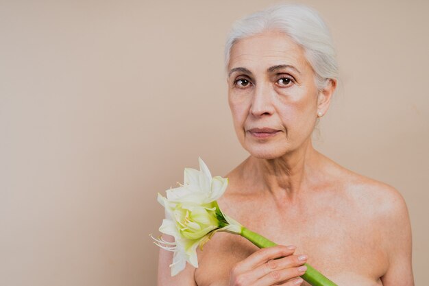 Beautiful senior woman with young and clean look, beauty shot