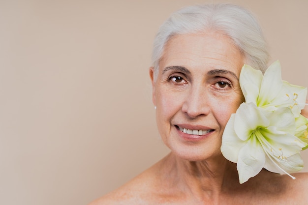 Beautiful senior woman with young and clean look, beauty shot