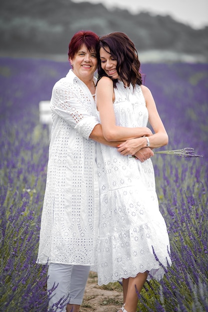 Beautiful sensual woman portrait outdoor in flowers field