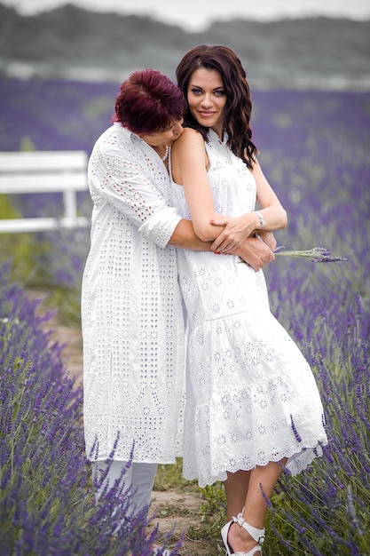 Beautiful sensual woman portrait outdoor in flowers field