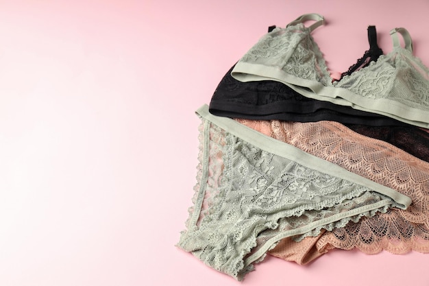 Beautiful set of women's underwear on pink background