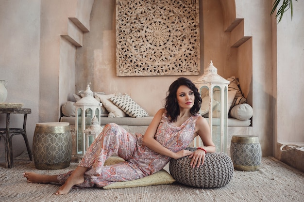 Beautiful sexy woman brunette hair east style arabic morocco furniture