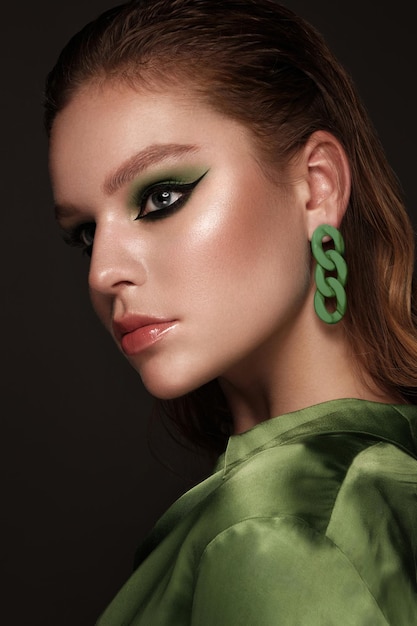 Beautiful sexy woman with classic makeup fashion hair and green eyes beauty face photo taken in the