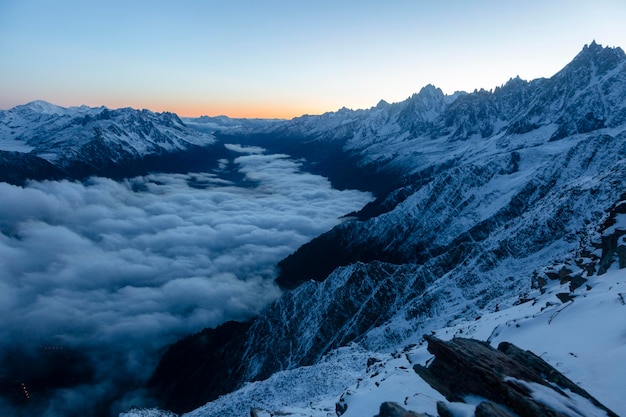 Beautiful sharp peaks start to shine as the sun rises in the French Alps