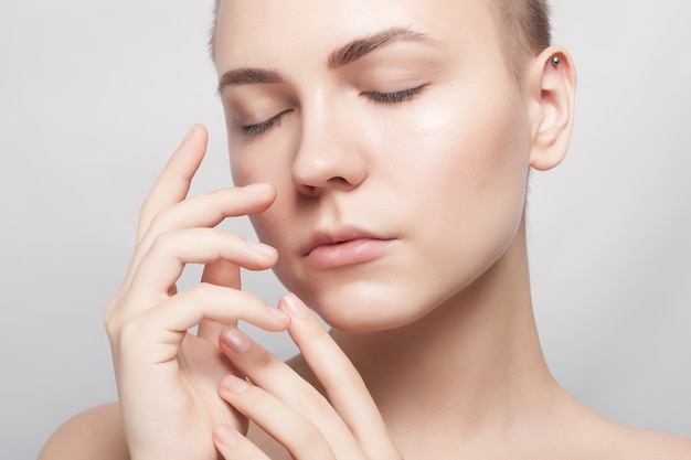 Beautiful short-haired woman with clear skin