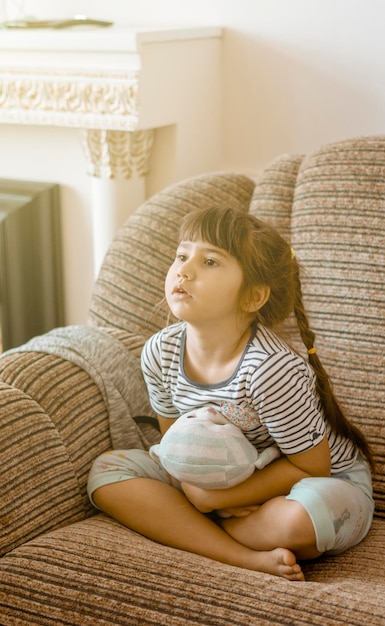 Beautiful shot of little sisters watching TV together