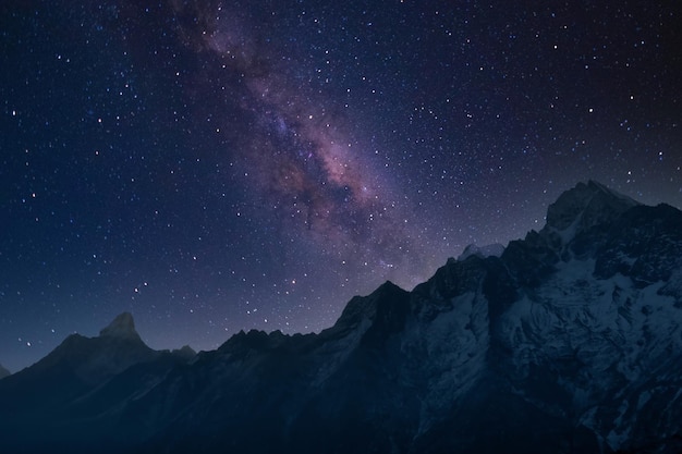 Beautiful shot of mountains under a starry sky at night