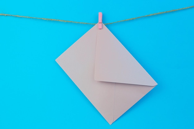 Beautiful shot of a pink envelope on a blue background