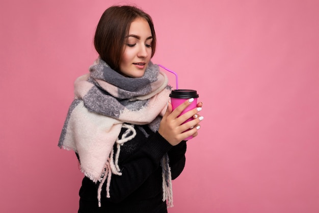 Beautiful sick sad young brunette woman wearing black sweater and warm scarf