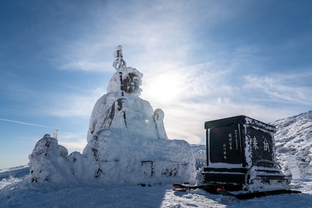 Beautiful silhouette scenic view of Big buddha jizo statue on summit of zao mountain, yamagata, tohoku, japan