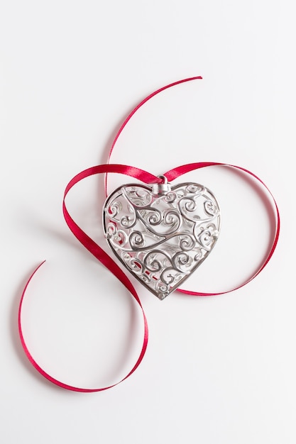 beautiful silver heart with ribbon