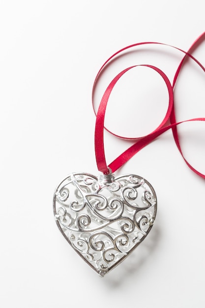 beautiful silver heart with ribbon