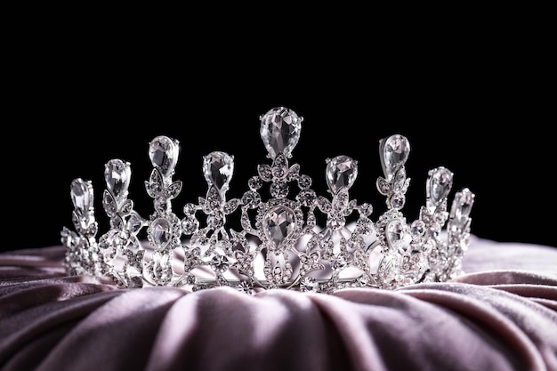beautiful silver tiara with diamonds on light cloth