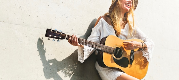 Beautiful singer songwriter with her guitar