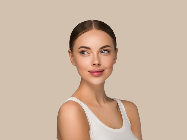 Beautiful skin face woman natural make up healthy skin beauty female model. Color background brown