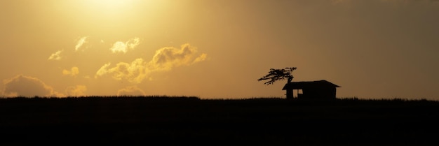 Beautiful Sky at Sunset with Cottage Silhouette