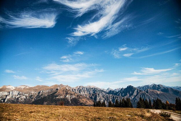 Beautiful sky with fluffy white clouds and mountains