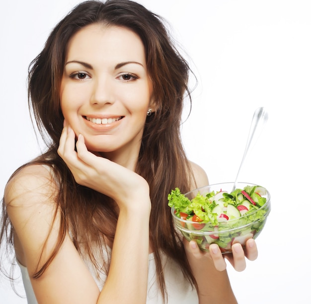 A beautiful slender girl eating healthy food