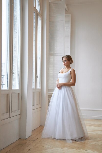 Beautiful slender woman in white wedding dress