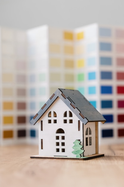 A beautiful small model of a house on a green background