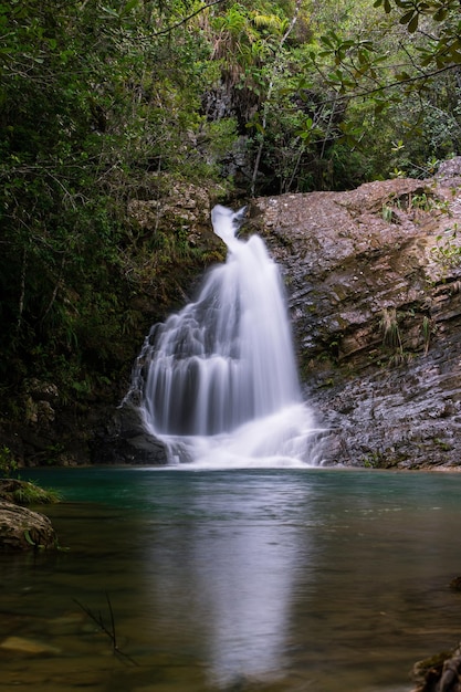 Beautiful small waterfall flowing over the rocks